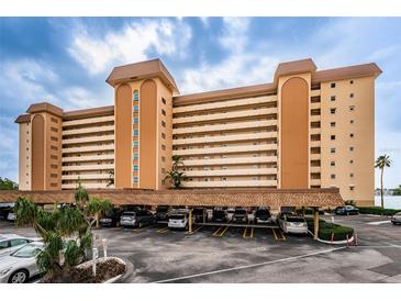 A multi-story building with ample parking underneath at 5130 Brittany S Dr # 202, St Petersburg, FL 33715