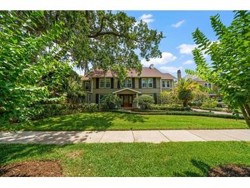 Two-story house with a large front yard at 327 Lotus Path, Clearwater, FL 33756