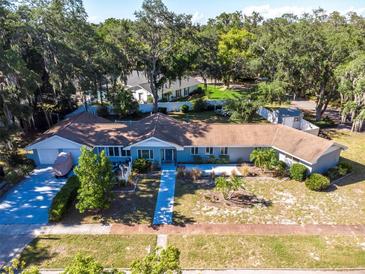 Ranch style home with a large yard at 5523 Carlton Rd, New Port Richey, FL 34652