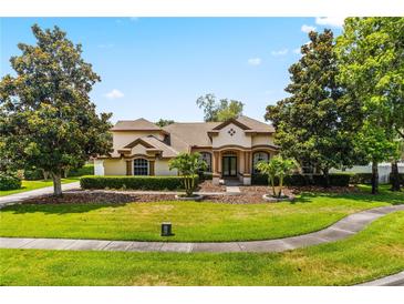 Beautiful two-story home with manicured landscaping and a large front yard at 1570 Preserve Way, Clearwater, FL 33764