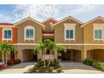 Exterior view of a two-story townhouse with attached garage at 17B Franklin S Ct, St Petersburg, FL 33711