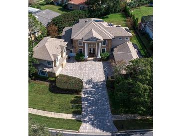 Luxury home with circular driveway and large backyard at 667 Richmond Close, Tarpon Springs, FL 34688