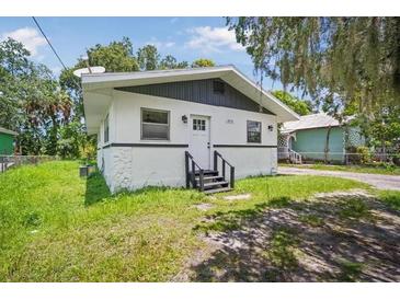 Quaint one-story home with a white exterior and gray accents at 1616 18Th Street E Ct, Palmetto, FL 34221