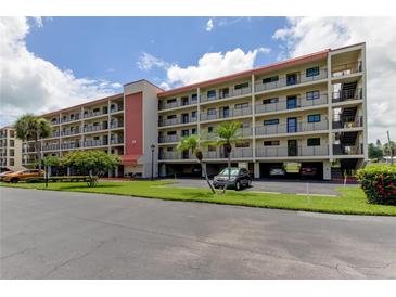 Two-story condo building with parking and landscaping at 9490 Harbor Greens Way # 205, Seminole, FL 33776