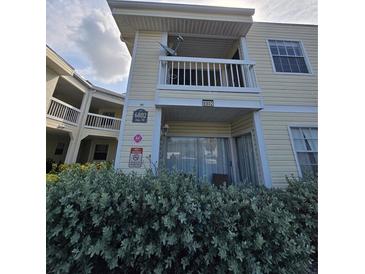Inviting two-story condo with a private balcony overlooking the manicured front yard and lush landscaping at 6802 Stones Throw N Cir # 14206, St Petersburg, FL 33710