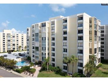 Multi-story building with parking and pool area at 830 S Gulfview Blvd # 601, Clearwater Beach, FL 33767