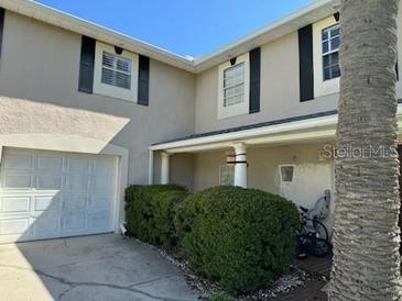 Two-story house with a garage and landscaping at 15529 Redington Dr, Redington Beach, FL 33708
