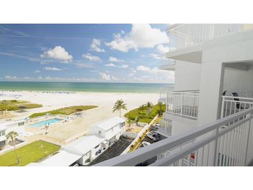 Condo balcony view overlooking the beach, Gulf of Mexico, pool, and manicured grounds at 5830 Midnight Pass Rd # 705, Sarasota, FL 34242