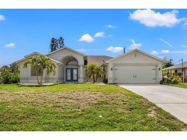 Single Gathering home with two car garage and landscaping at 7162 Benson St, Englewood, FL 34224