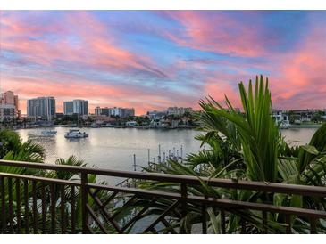 Stunning sunset over the waterfront with boats at 158 Brightwater Dr # 1, Clearwater Beach, FL 33767