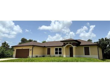 Attractive single-story home with a brown roof and a well-maintained lawn at 1495 Robwood Ter, North Port, FL 34288