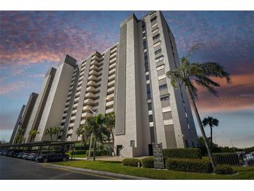 Exterior view of a tall residential building at 7050 Sunset S Dr # 203, South Pasadena, FL 33707