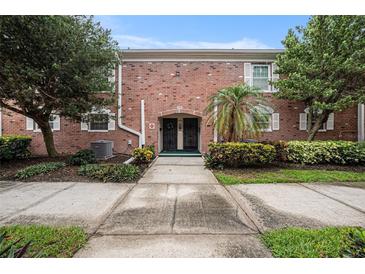 Brick building exterior with a walkway leading to the entrance at 3455 41St S Ter # 208, St Petersburg, FL 33711