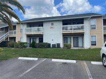 Two-story building with balconies and parking at 455 Alt 19 S # 21, Palm Harbor, FL 34683