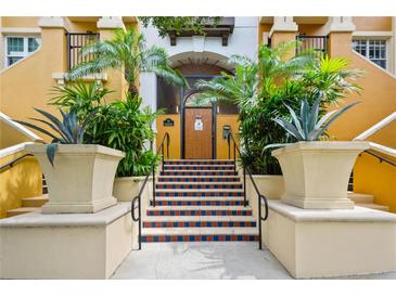 Building entrance with stairs and lush landscaping at 100 4Th S Ave # 426, St Petersburg, FL 33701