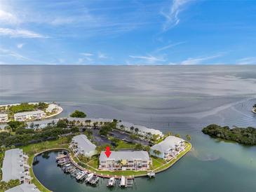 Stunning aerial view of waterfront condos with boat docks and serene water views and boat parking at 5257 Beach Se Dr # D, St Petersburg, FL 33705