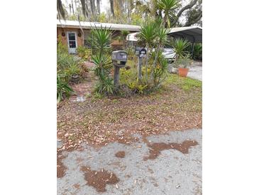 House exterior with a yard needing some landscaping at 1401 W Spencer St, Plant City, FL 33563