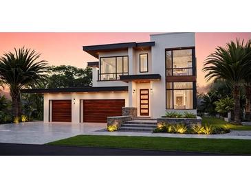 Stunning modern home with a two-car garage, and a beautiful stone accents, providing curb appeal at 705 W Amelia Ave, Tampa, FL 33602