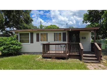 Small house with wooden steps and porch at 2805 58Th N Pl, St Petersburg, FL 33714