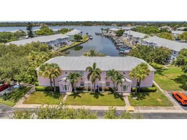 Waterfront community with canal access and charming pink buildings at 5157 Beach Se Dr # C, St Petersburg, FL 33705