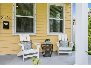 Front porch with two white chairs and small table at 2430 6Th N Ave, St Petersburg, FL 33713