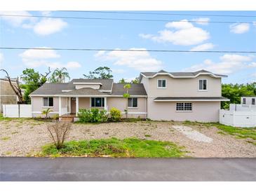 Two story home with a spacious yard at 651 Jungle Queen Way, Longboat Key, FL 34228
