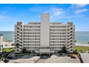Stunning waterfront condominium building featuring private balconies and breathtaking ocean views on a clear day at 7000 Beach Plz # 505, St Pete Beach, FL 33706