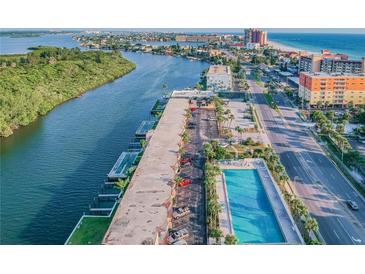 Aerial view of waterfront property with pool and parking at 18399 Gulf Blvd # 372, Indian Shores, FL 33785