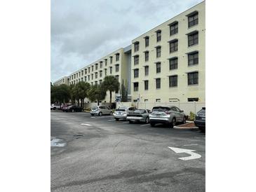 Multi-story apartment building with parking lot at 701 S Madison Ave # 405, Clearwater, FL 33756