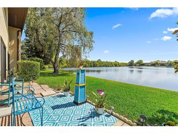 Relaxing patio overlooking a tranquil lake. Perfect for outdoor enjoyment at 750 N Village N Dr # 106, St Petersburg, FL 33716