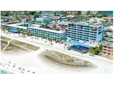 Aerial view of beachfront hotel with pool and beach access at 10650 Gulf Blvd # 340, Treasure Island, FL 33706