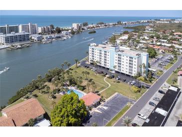 Aerial view of condo building near the water at 10216 Regal Dr # 708, Largo, FL 33774
