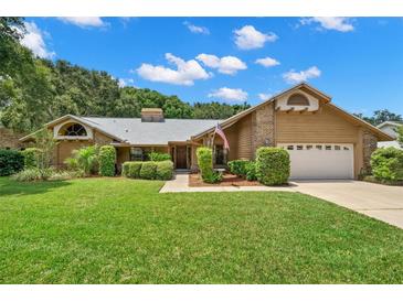 Charming single-story house with a well-maintained lawn at 3045 Kevlyn Ct, Safety Harbor, FL 34695
