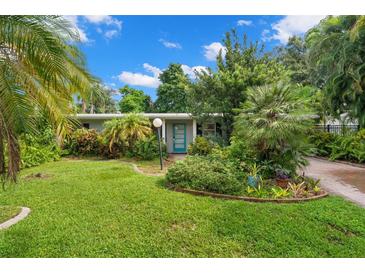 Charming house with a lush, landscaped front yard at 2517 Trinidad St, Sarasota, FL 34231
