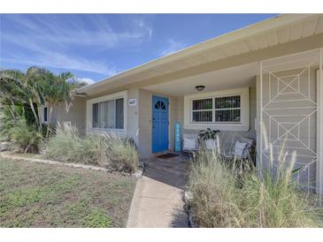 Inviting home exterior with a blue front door and porch at 6637 Poinsettia S Ave, St Petersburg, FL 33707