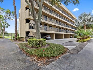 Condo building with parking and landscaping at 1933 Golfview Dr # 1933, Tarpon Springs, FL 34689