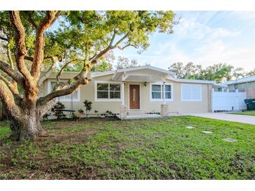 Updated bungalow with a covered porch and mature landscaping at 219 6Th Sw Ave, Largo, FL 33770