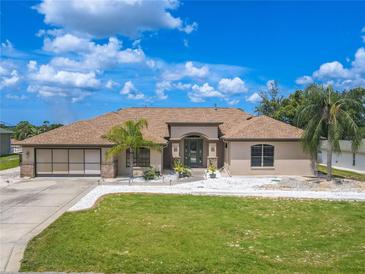Single-story home with a large yard and attached garage at 10177 Sunburst Ct, Spring Hill, FL 34608