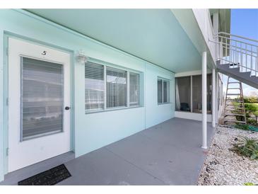 Building exterior showcasing entrance and patio area at 1840 Shore S Dr # 5, South Pasadena, FL 33707
