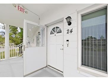 Exterior view of condo building entrance and hallway at 2430 Brazilia Dr # 24, Clearwater, FL 33763