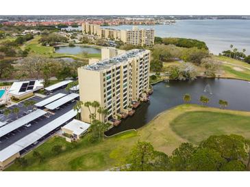 High-rise condo building overlooking golf course and lake at 2620 Cove Cay Dr # 107, Clearwater, FL 33760