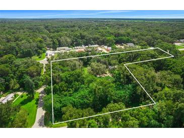 Aerial view of property showing its location and surrounding area at 1026 Roosevelt Ave, Spring Hill, FL 34604