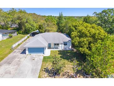 Photo one of 11037 Lightwood St Spring Hill FL 34608 | MLS W7863842