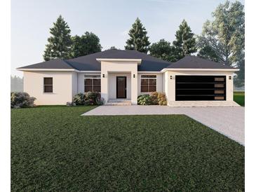 Single-story home with modern design, 2-car garage, and landscaped yard at 4101 Valley Brook Ct, Spring Hill, FL 34606
