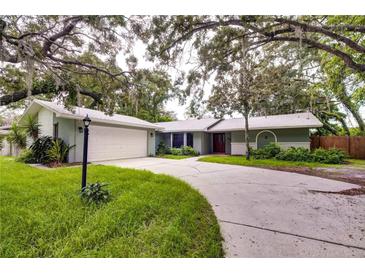House exterior with driveway and landscaping at 1423 Meadow Lark Rd, Spring Hill, FL 34608