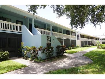 Well maintained building exterior with lush landscaping at 1955 Abrico Dr # G7, Lutz, FL 33558