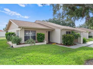 Exterior view of the house with landscaping at 3849 Staysail Ln, Holiday, FL 34691