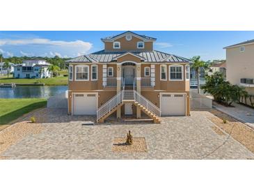 Two story waterfront home with attached two car garage at 3448 Triggerfish Dr, Hernando Beach, FL 34607