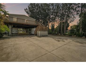 Elevated home with large deck and ample parking at 14904 Old Dixie Hwy, Hudson, FL 34667