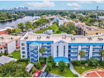 Aerial view of a waterfront condo community featuring a building with blue accents at 2424 W Tampa Bay Blvd # L-302, Tampa, FL 33607
